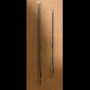 Long silver earrings with spikes